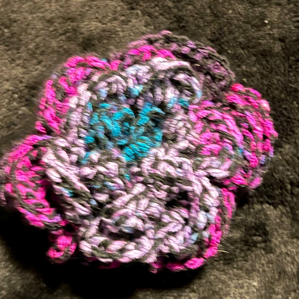 Crocheted flower ponytail hair tie